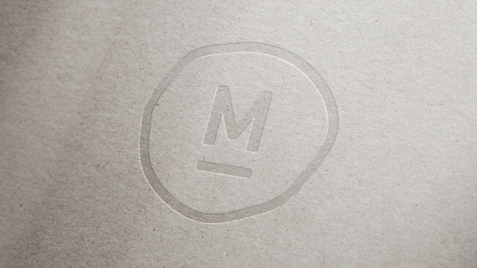 Melv&aelig;rk logomark closeup on grey paper by Camilla Wedege