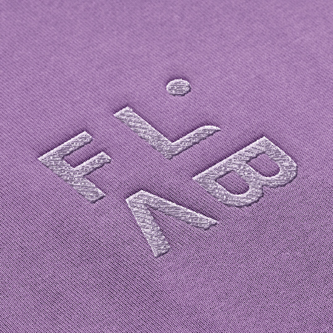 FLAB logo embroidered onto purple fabric mockup by Camilla Wedege